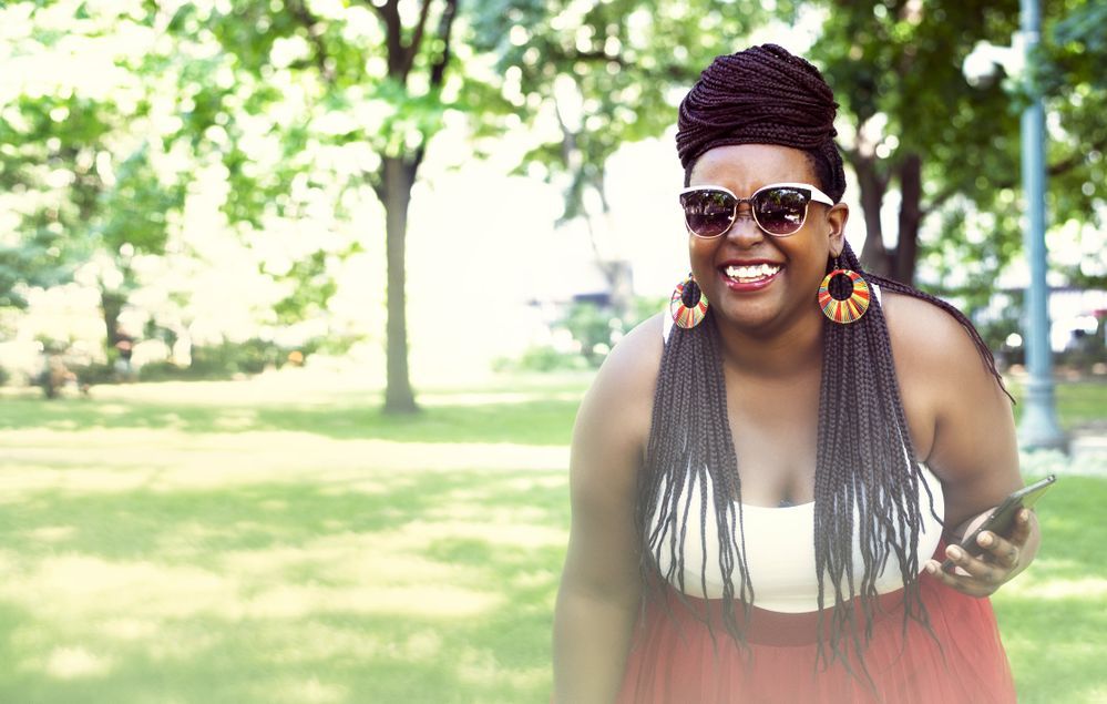 black-woman-with-braids-standing-in-park.jpg